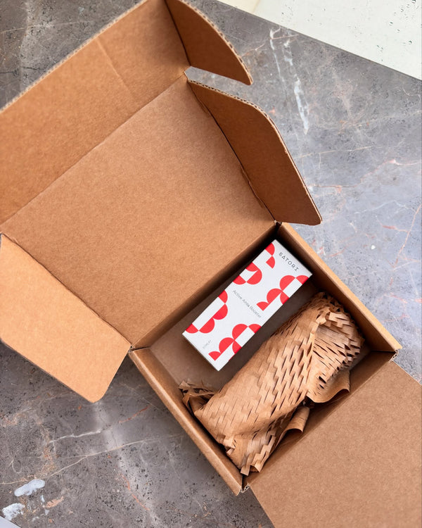 Open cardboard box showing Satori Skin